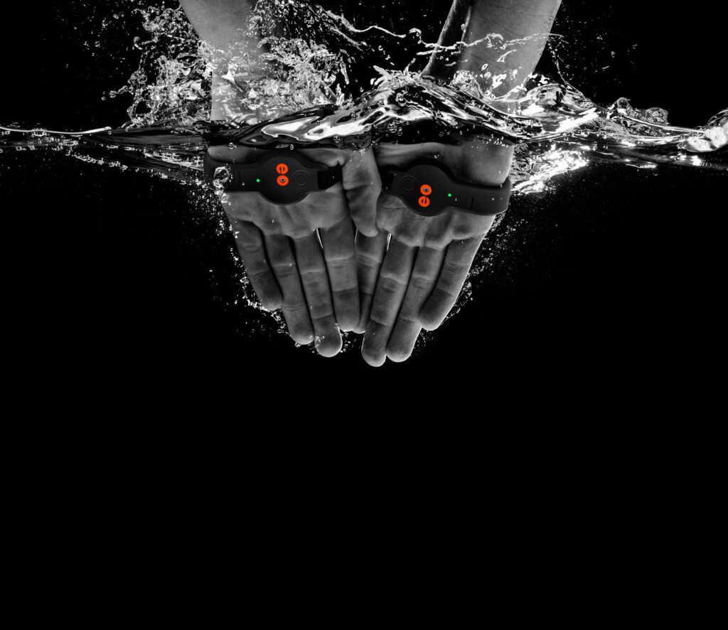 swimmer uses two hands to demonstrate how Mindful Swimming in Travelers Rest SC uses eo SwimBetter's stroke analysis technology